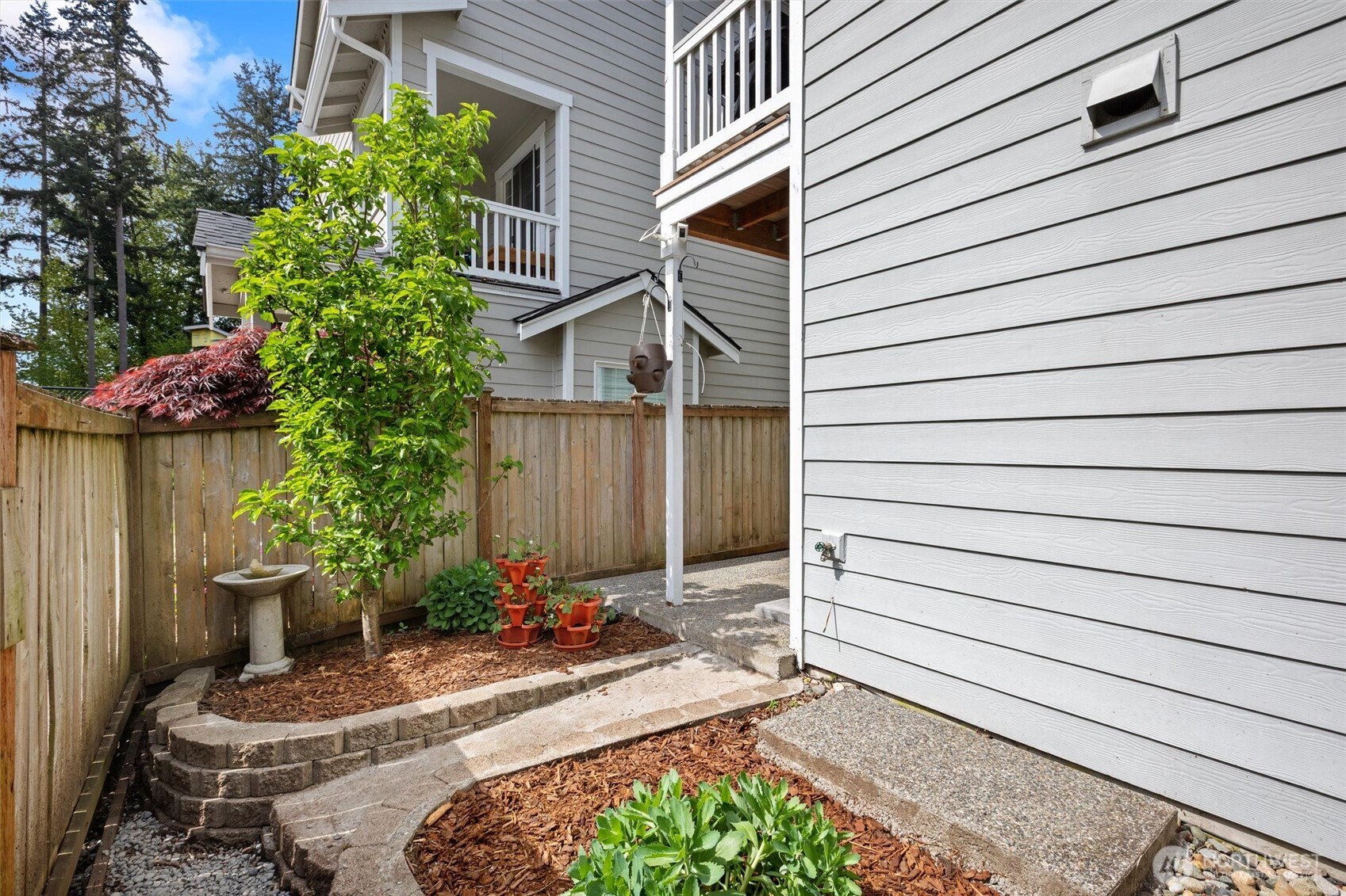 This home offers a RARE fenced-in yard with low maintenance flower beds and patio!