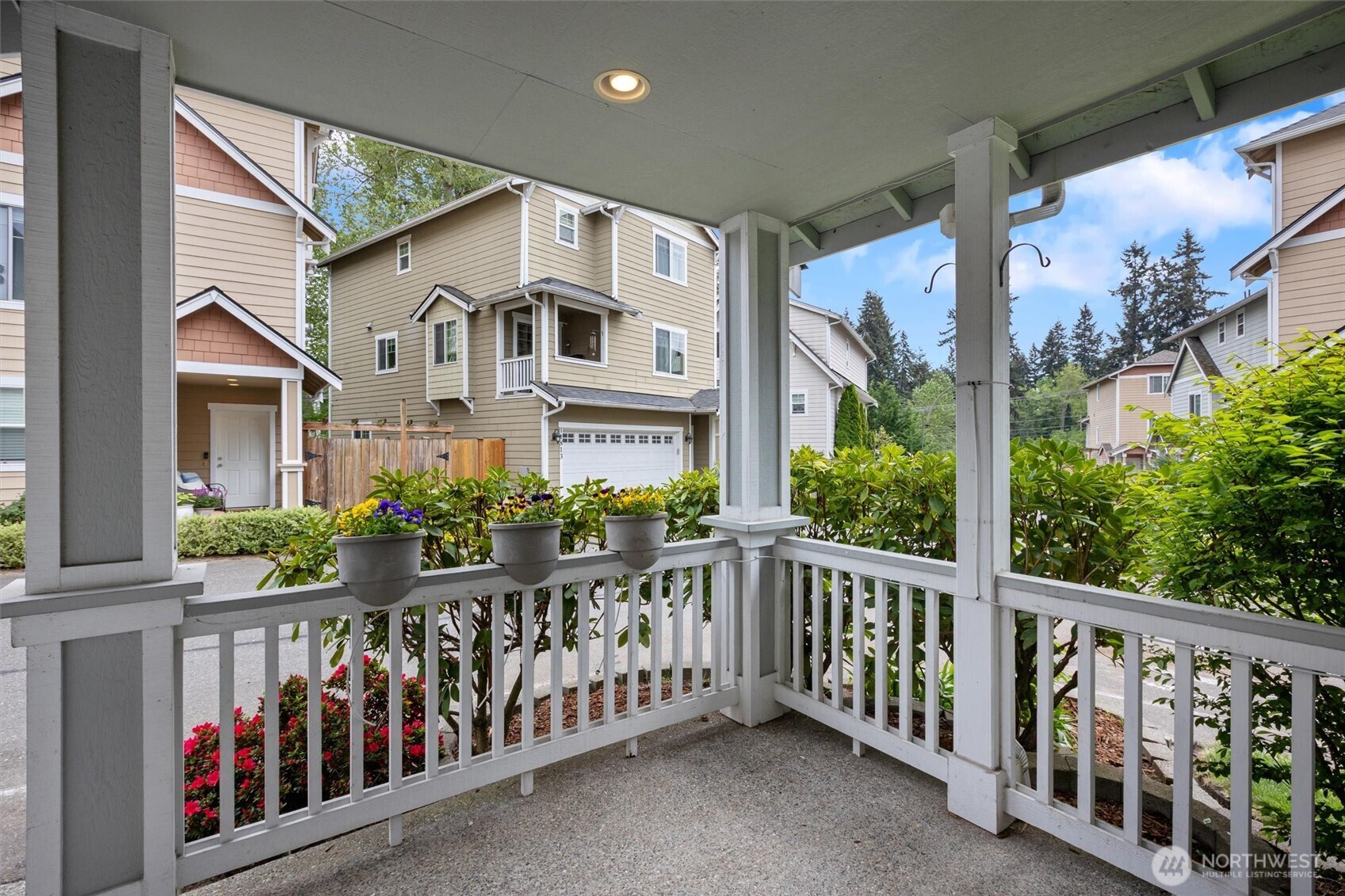 Add your own pots of flowers or baskets to this sweet entry.