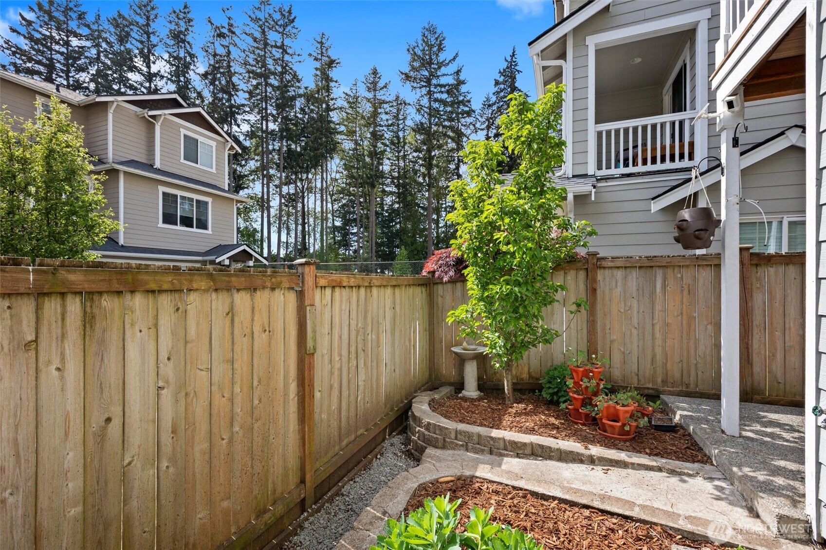 The yard is sun drenched and offers a peaceful oasis.