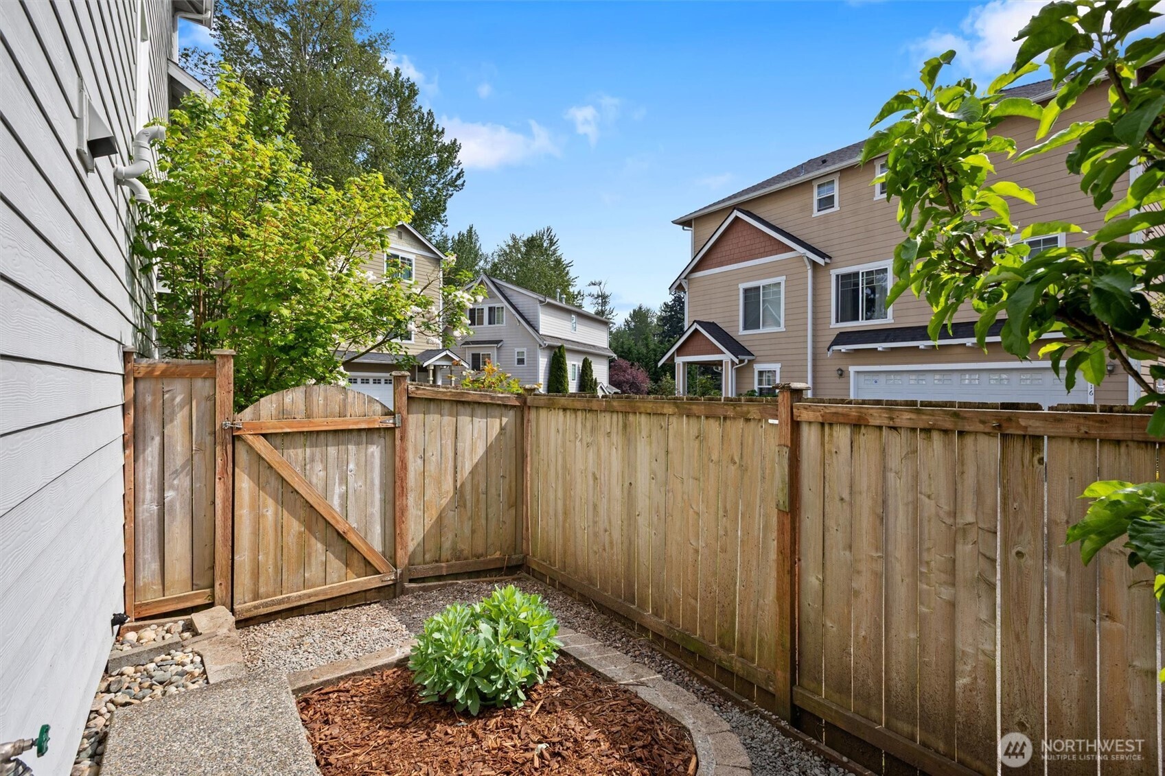 The gate allows for easy access to and from the front yard.
