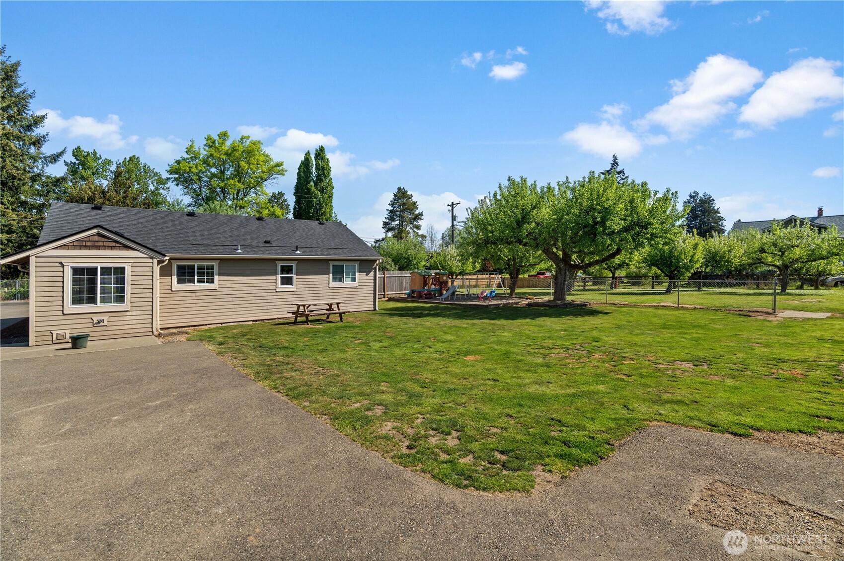 Back yard with mature fruit trees