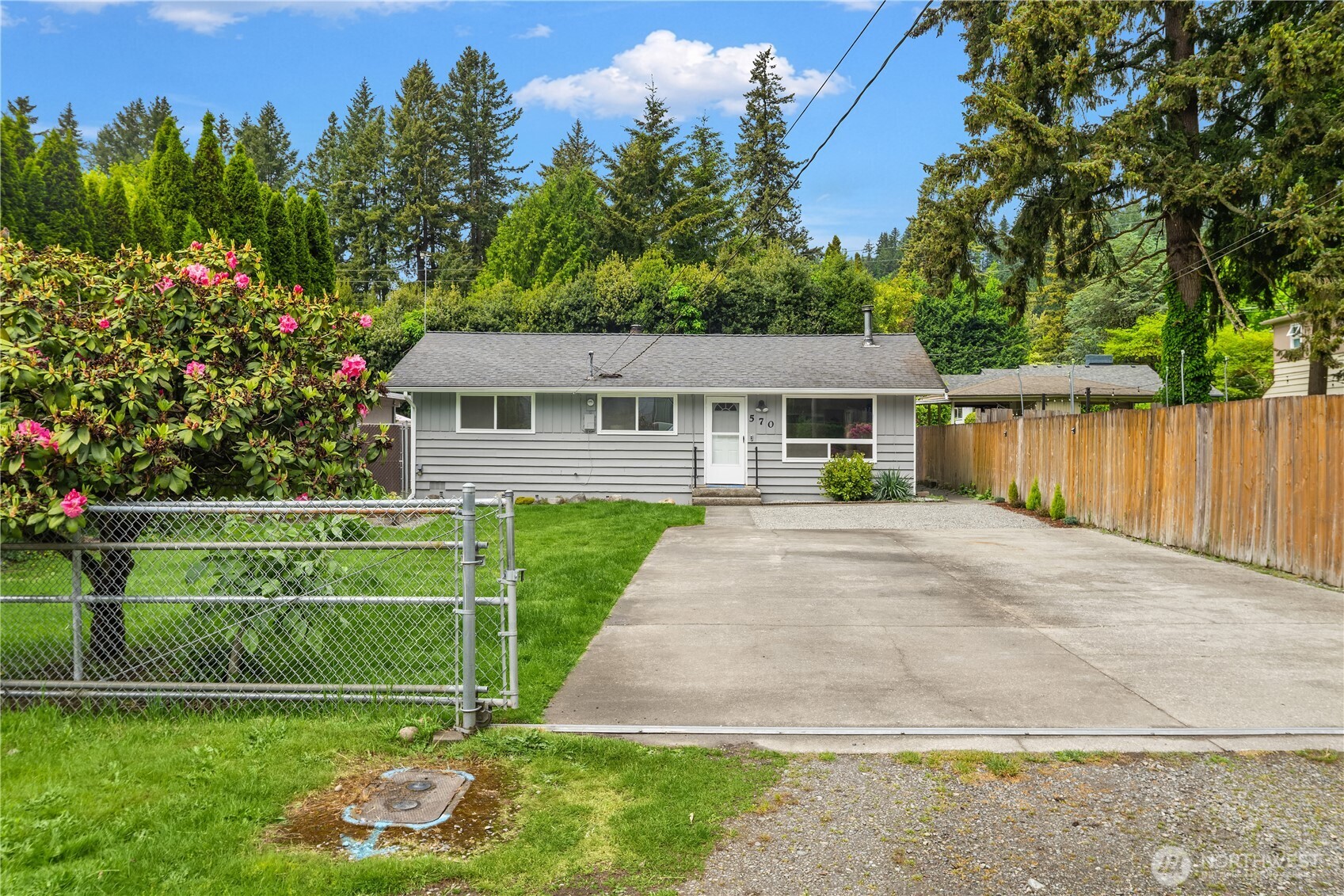 huge front yard with lovely raised garden bed. There is plenty of space to add on and completely redo this home.