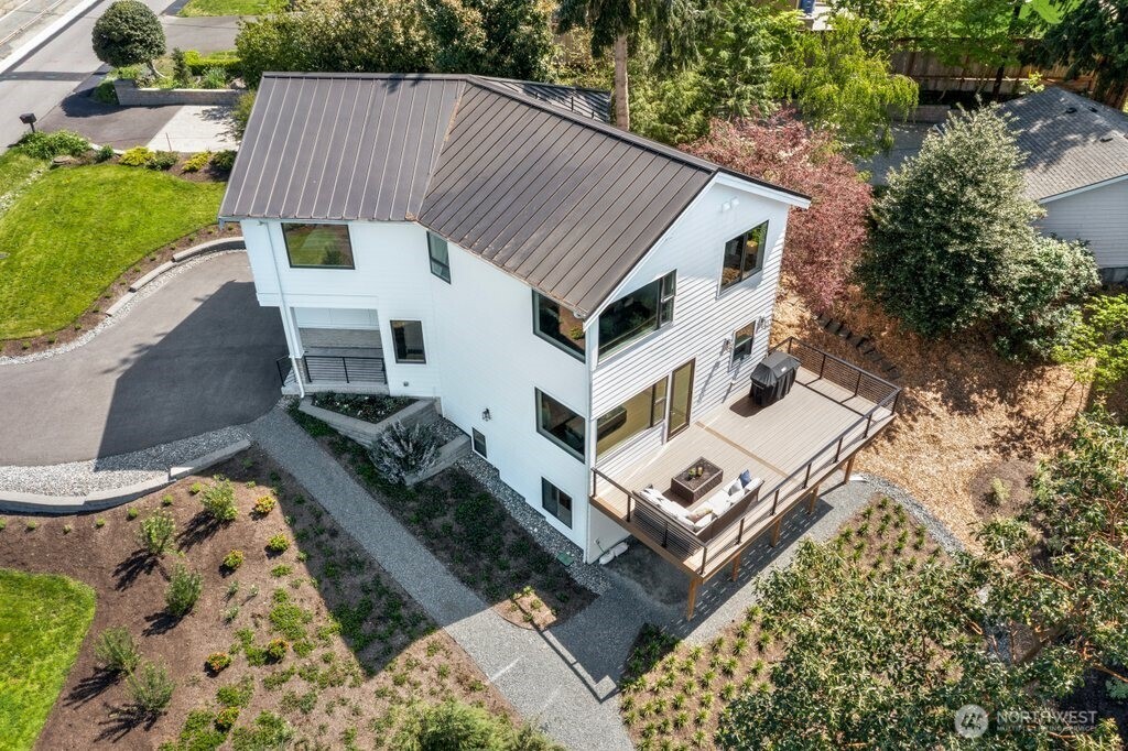 Thoughtfully landscaped with mature trees and lush greenery