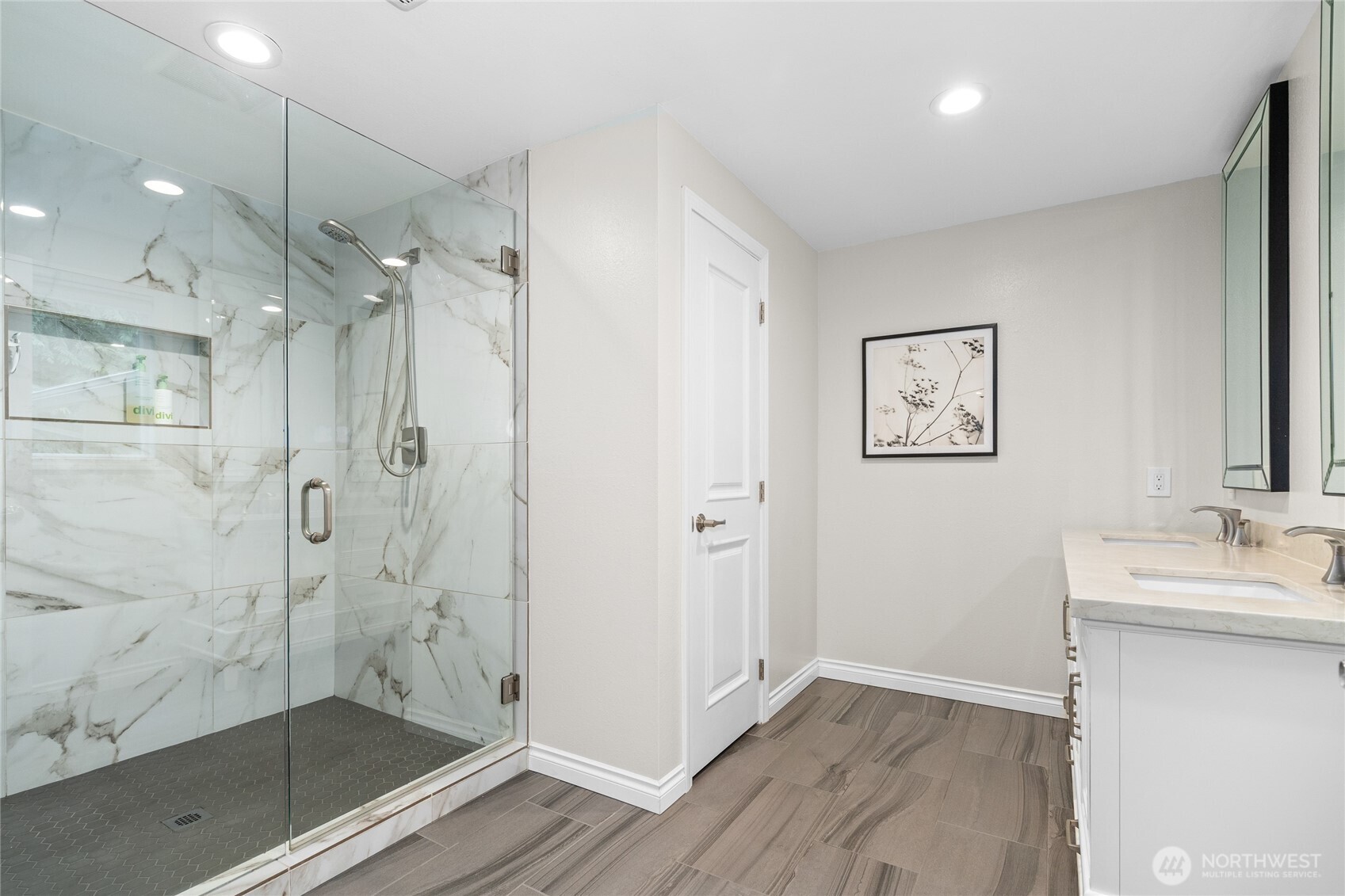 Owner Suite with huge walk-in closet, windows to backyard, en-suite bathroom with 2 sinks and large glass shower!