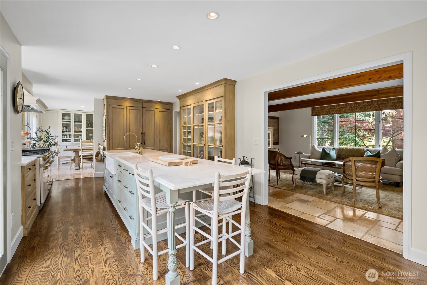 Walk-in pantry with sink, microwave and prep area.