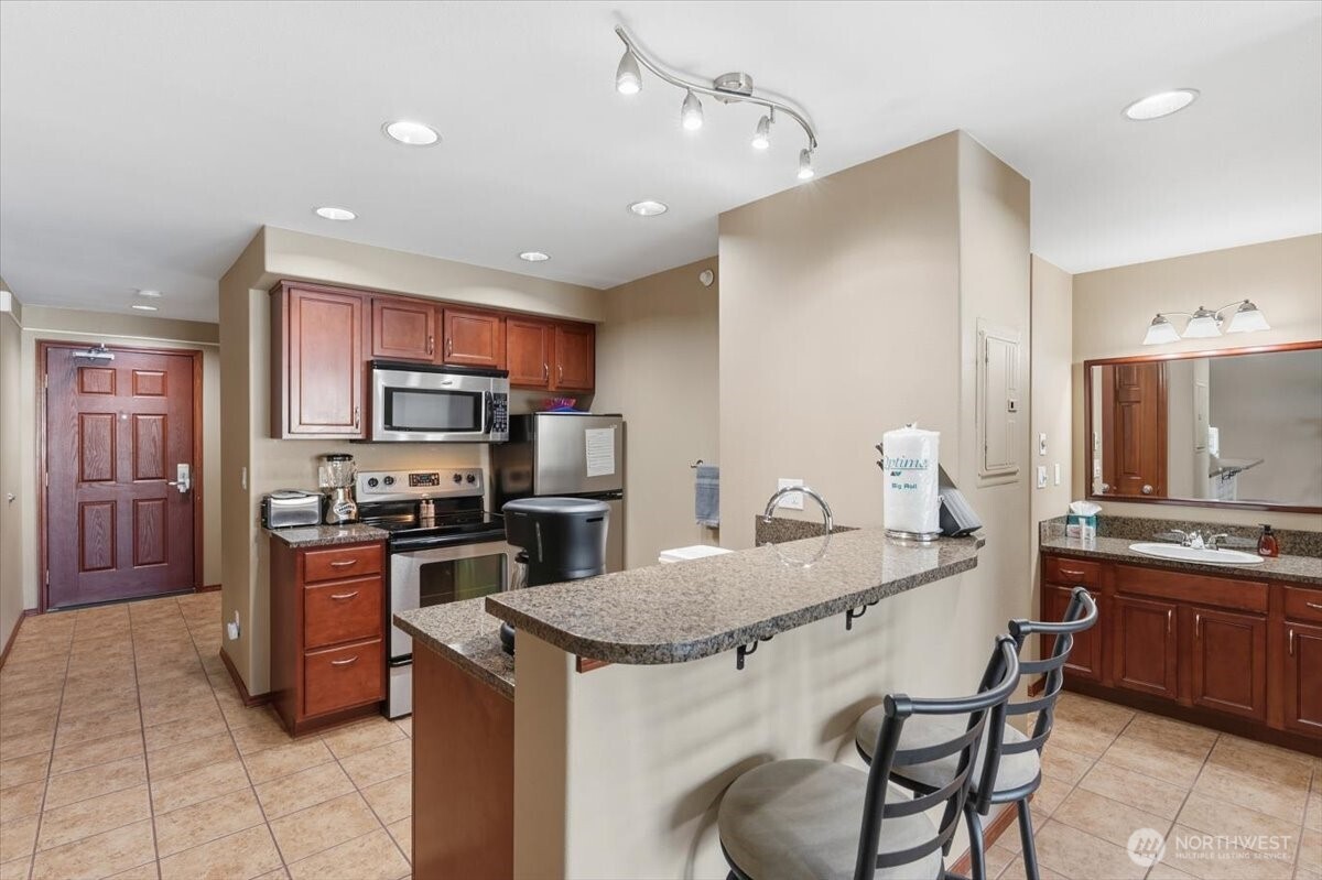 Fully equipped kitchen and open entertaining space make hosting effortless.