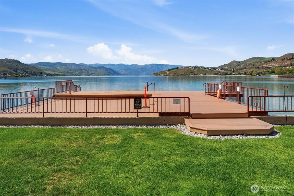 Experience resort-style living with lakefront pool, hot tub, dock access, and guest buoys.