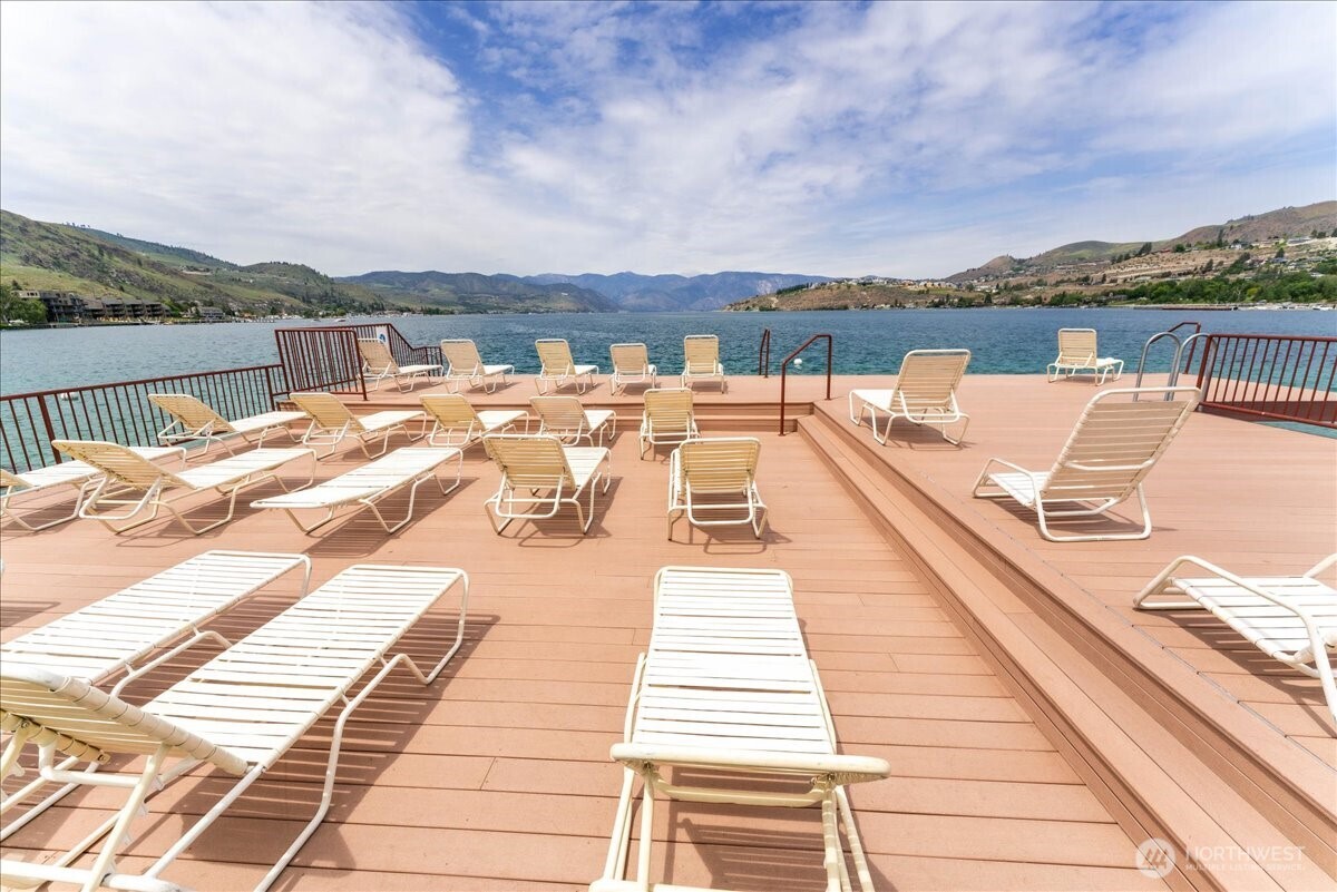Enjoy resort-style lake living with a pool, hot tub, dock, and expansive green space.