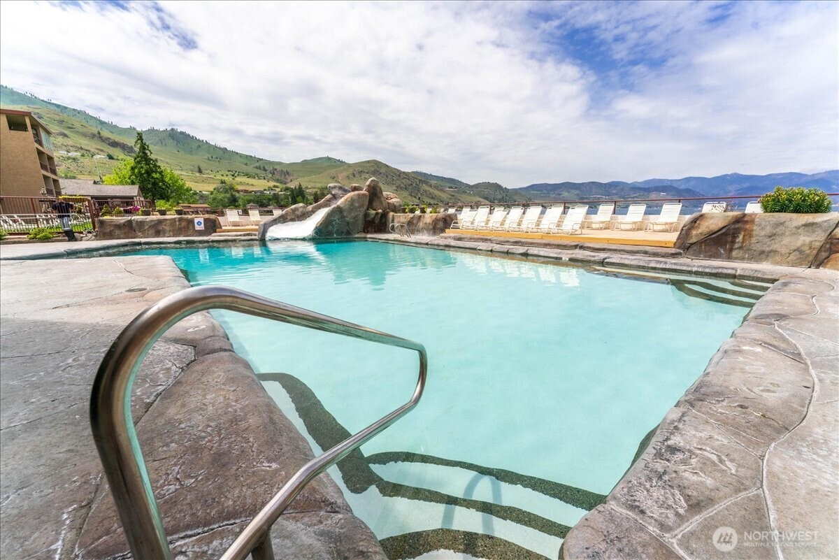 The lakefront pool and hot tub create a true resort atmosphere right outside your door.