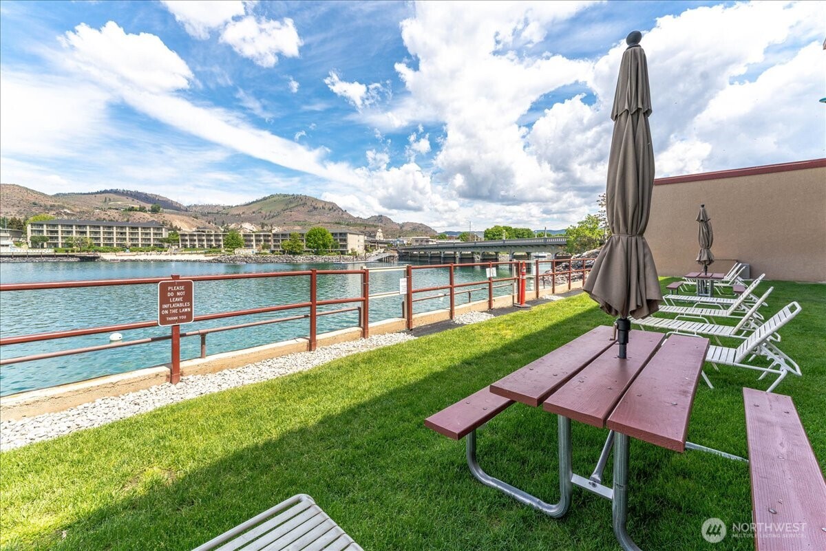 Enjoy resort-style lake living with a pool, hot tub, dock, and expansive green space.