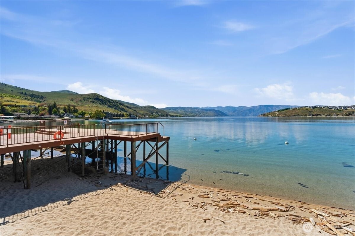 Enjoy resort-style lake living with a pool, hot tub, dock, and expansive green space.