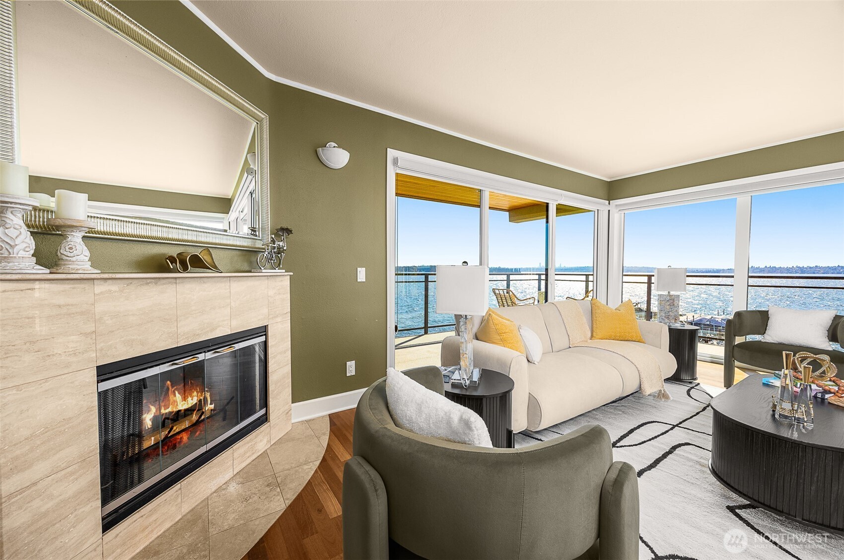 Living room looking southwest. Fireplace and deck visible.