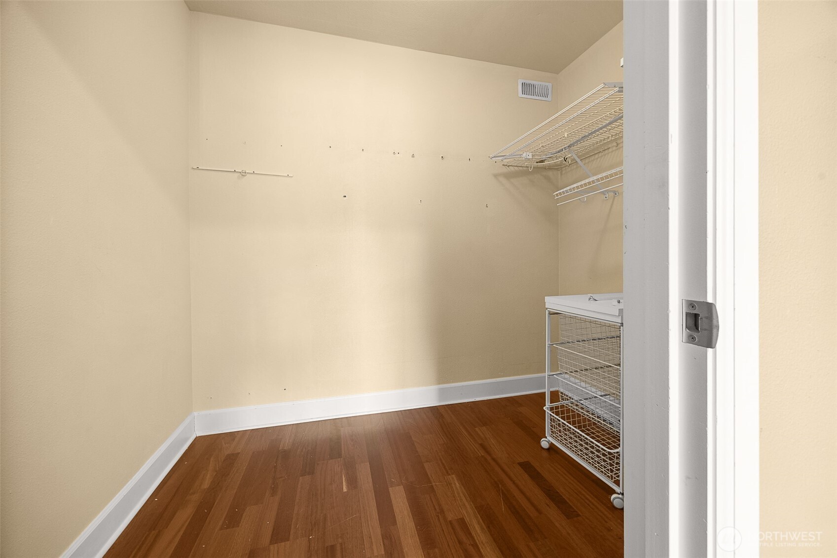 Primary bedroom walk-in closet.