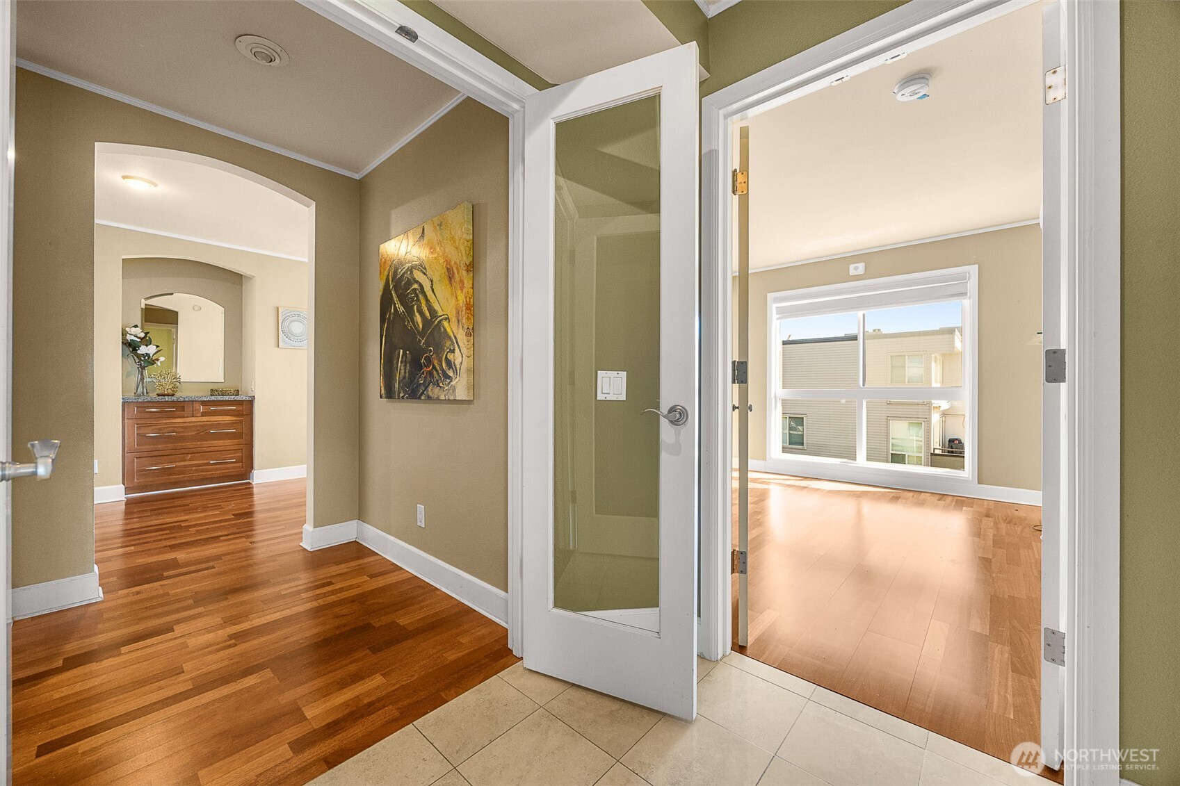 The entry to the left is the primary bedroom the door on the right is to another bedroom.