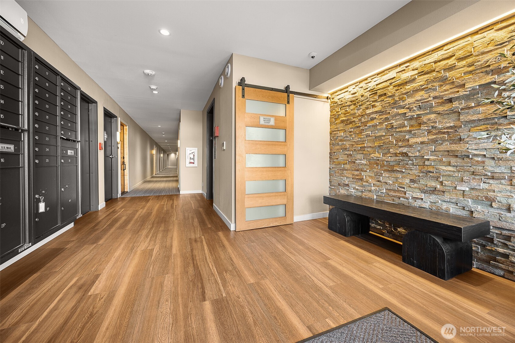 Lobby area. Mailboxes, area for packages, elevator and stairwell. All updated about 4 years ago.
