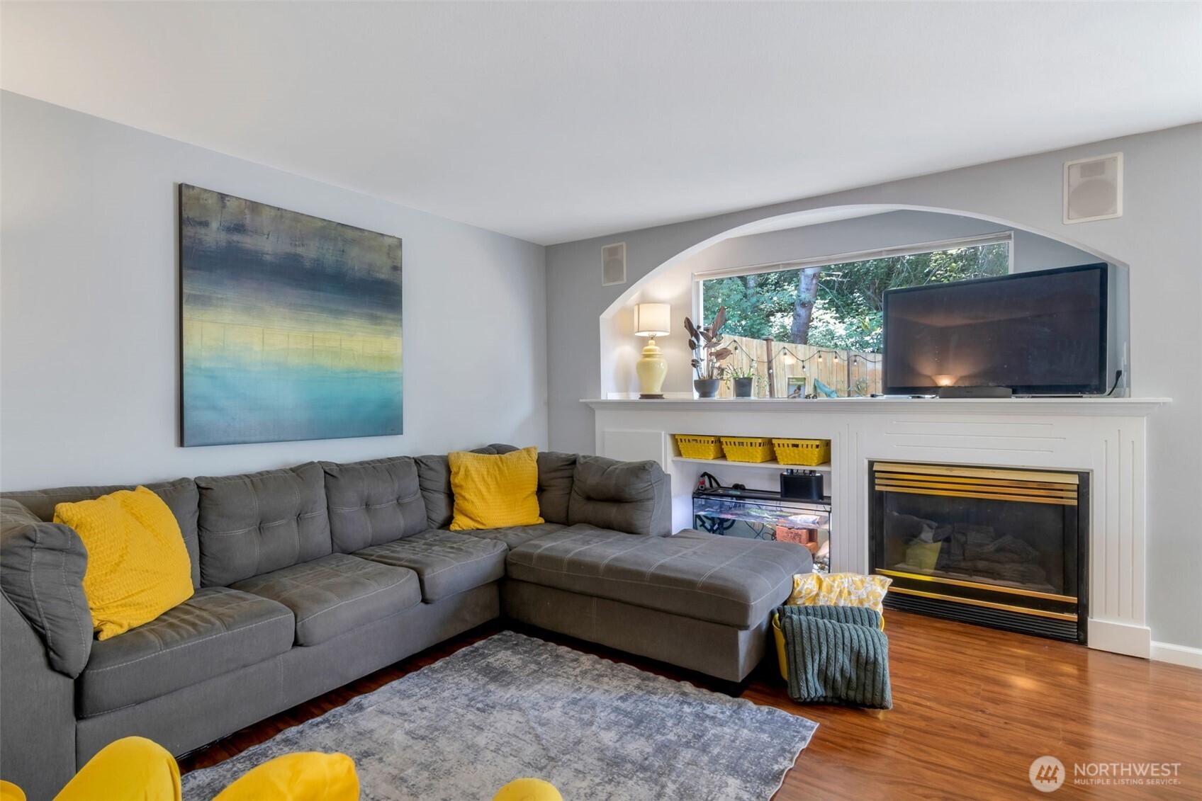 A generously sized living room big enough for a large sectional couch! The living room is flooding with light from your private backyard patio!