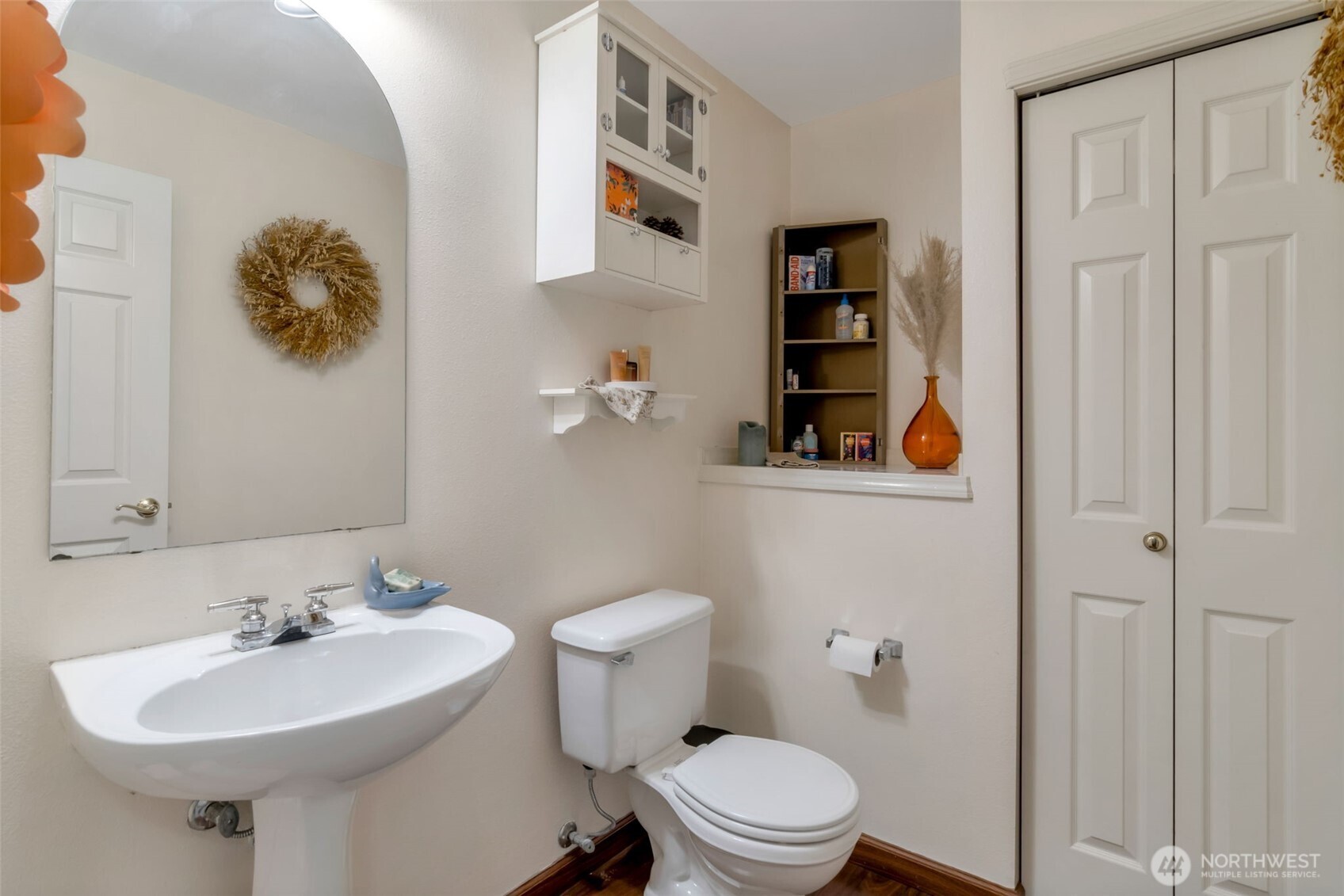 A half-bath with storage provides comfort and convenience - ideal for 2-story living!