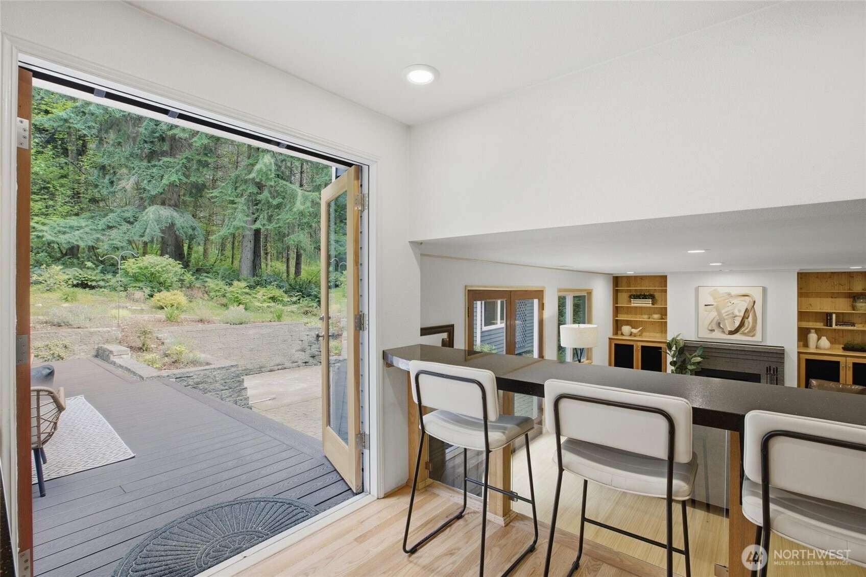 Spacious primary suite with remodeled bathroom, dedicated vanity, and LED mirror in this Woodinville retreat