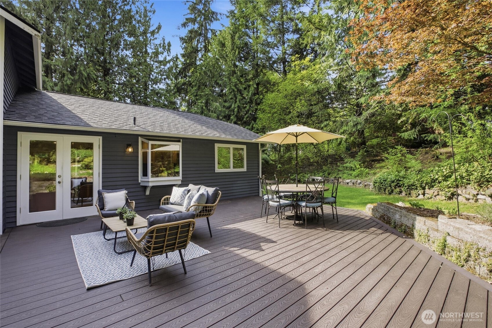 Entertain year round on the spacious backyard deck surrounded by peaceful Woodinville scenery