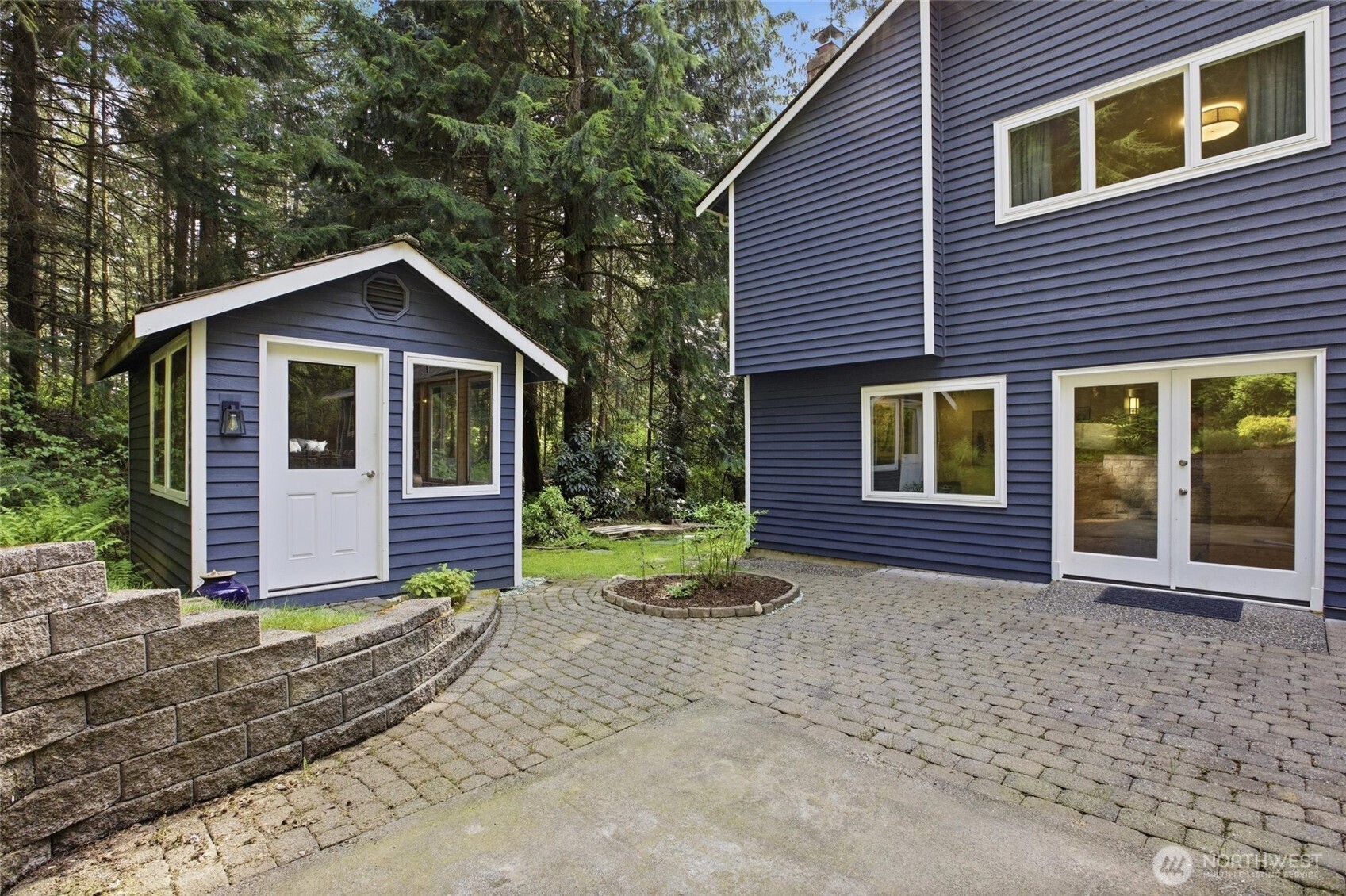 Charming she shed and garden shed provide flexible space for hobbies, storage, or creative work
