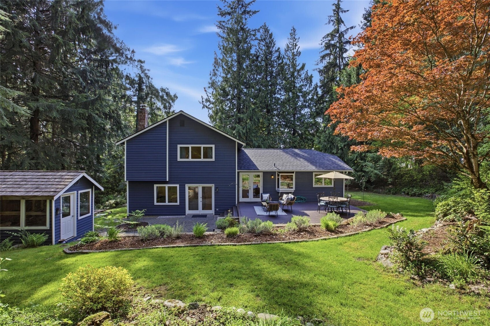 Open and airy Woodinville home featuring vaulted ceilings and seamless indoor outdoor flow