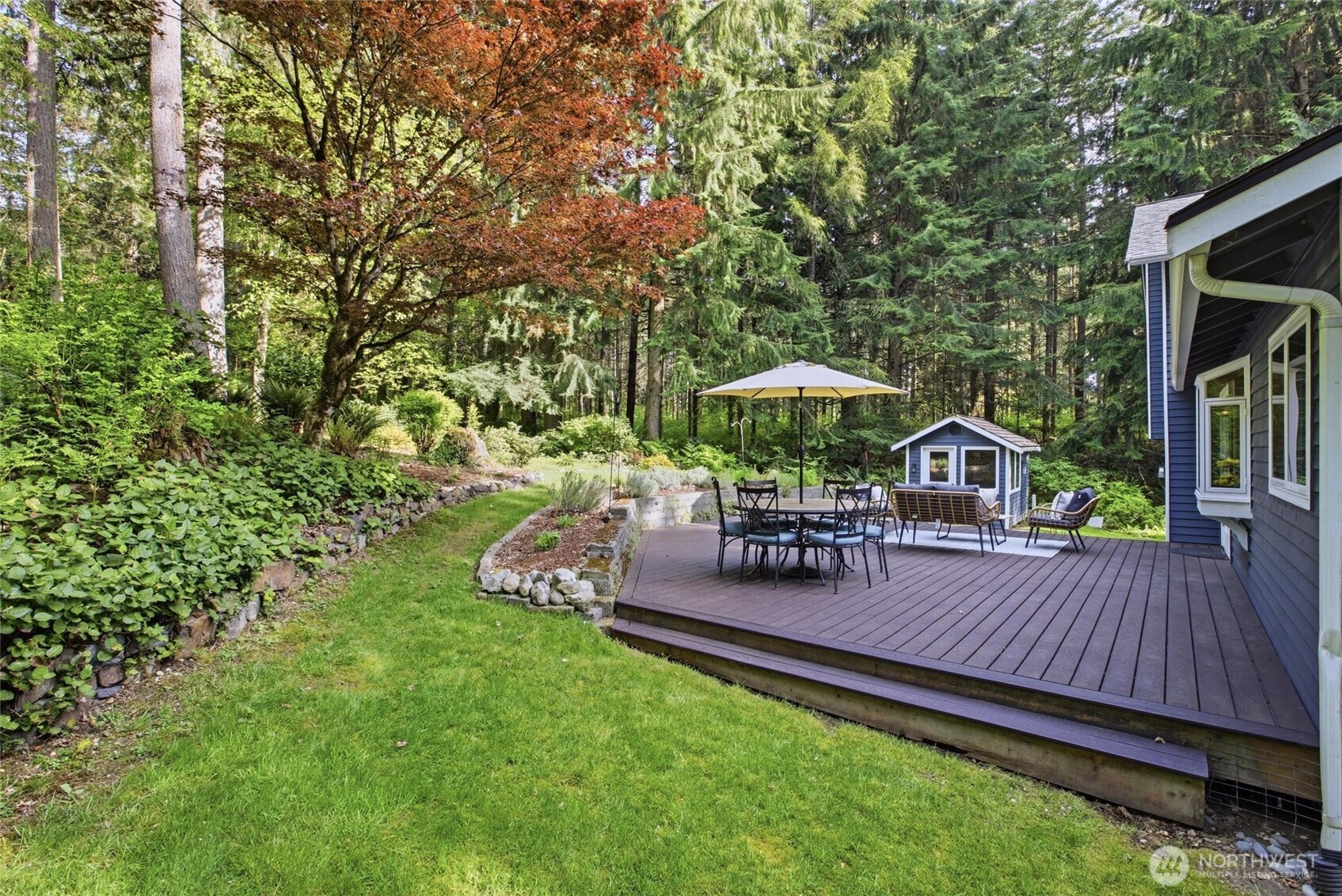 Luxury touches throughout this Woodinville home including custom cabinetry, stone countertops, and hardwood flooring