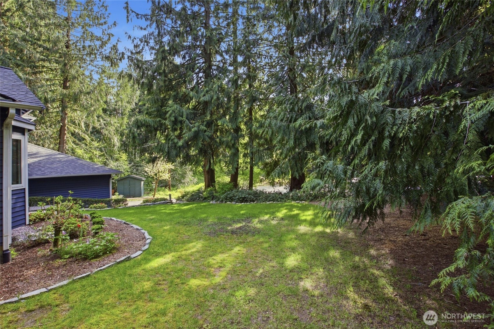 Peaceful Woodinville greenbelt property with trails, fruit trees, and beautifully maintained landscaping