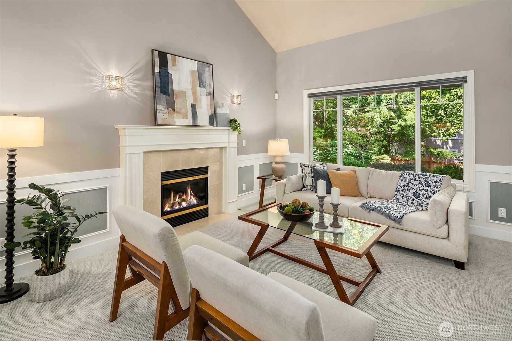 Dining room flows seamlesly into living room framed with picture windows