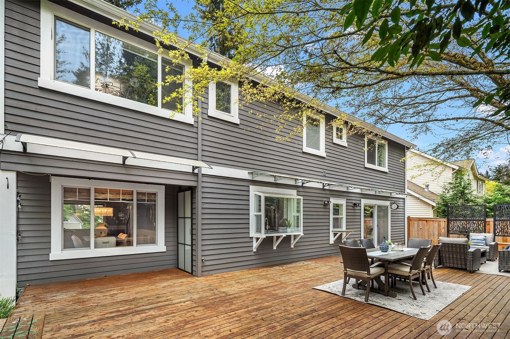 Extra large patio with mature landscaping for your ultimate backyard hangout and privacy!