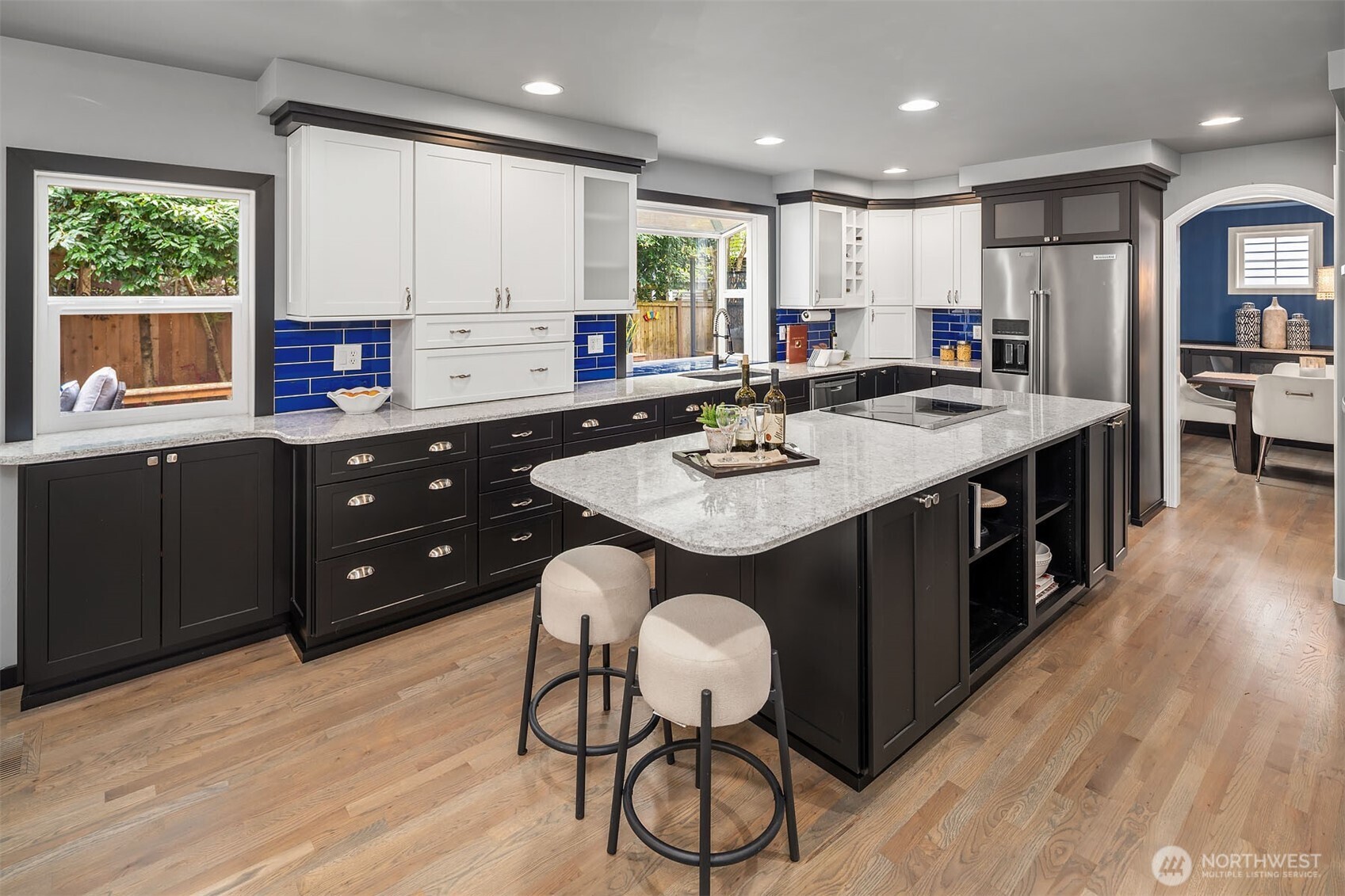 New quartz counters, induction cooktop (plumbed for gas), custom cabinets, and more!