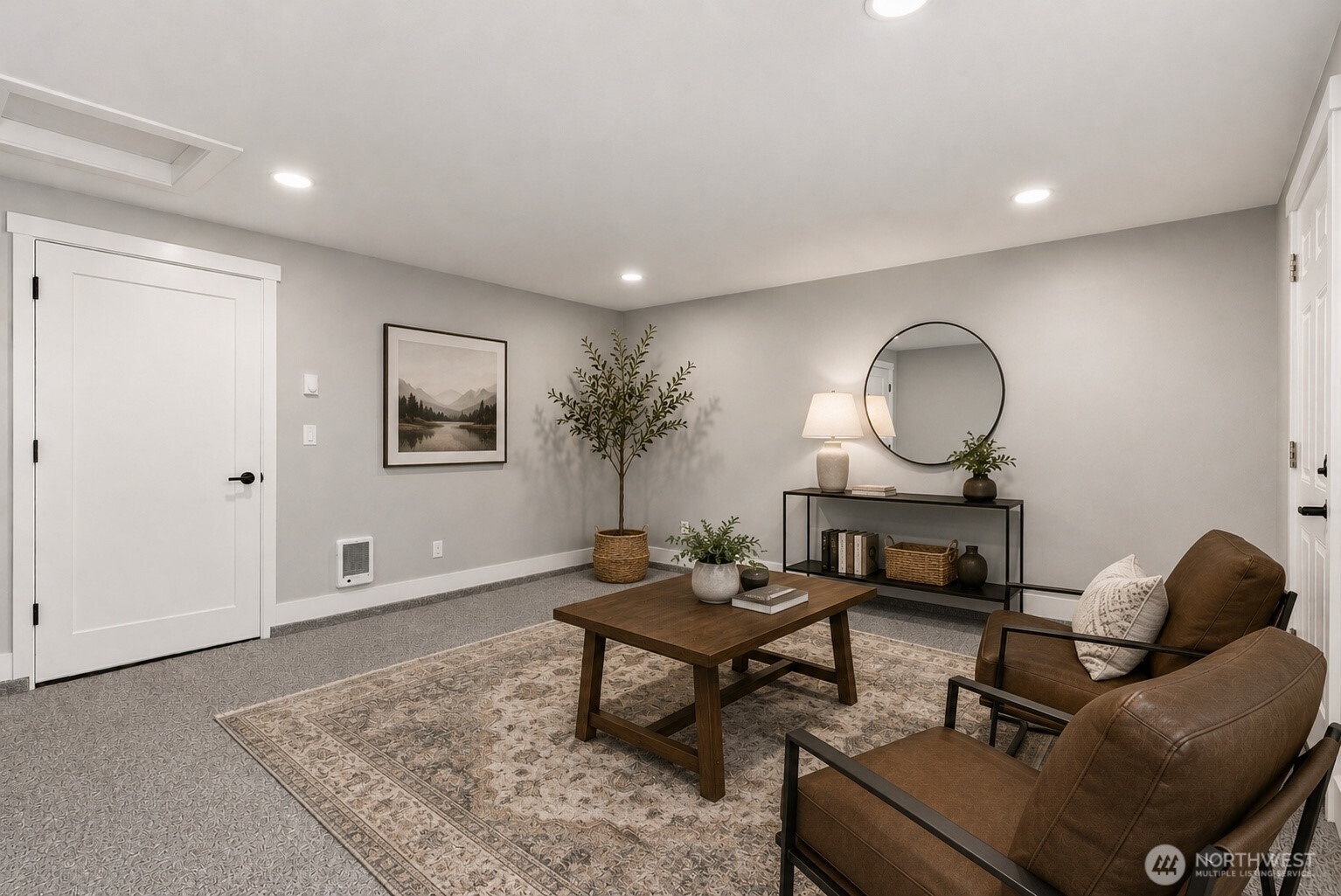 Bedroom #4 with exterior access offers endless flexibility, perfect for a home office, guest bedroom, hobby room, or creative space. Virtually staged furniture shown for inspiration.