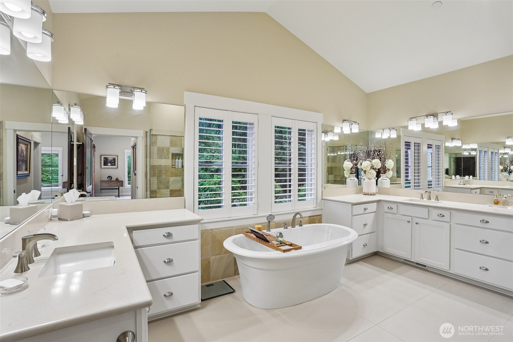 two vanities, glass shower and soaking top
