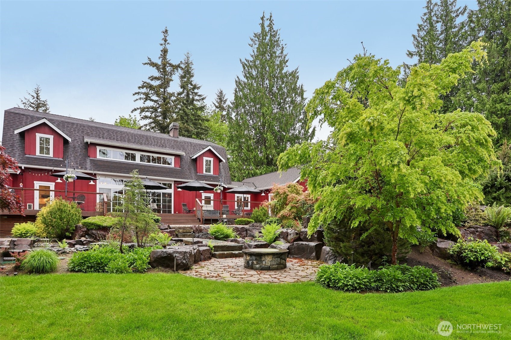 primary suite enjoys views of beautiful backyard
