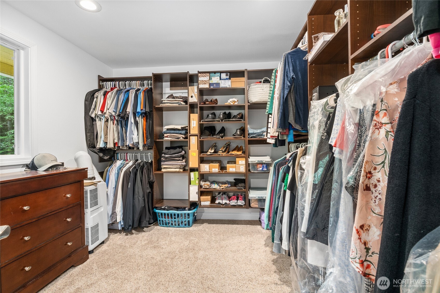 Owner Suite with huge walk-in closet, windows to backyard, en-suite bathroom with 2 sinks and large glass shower!