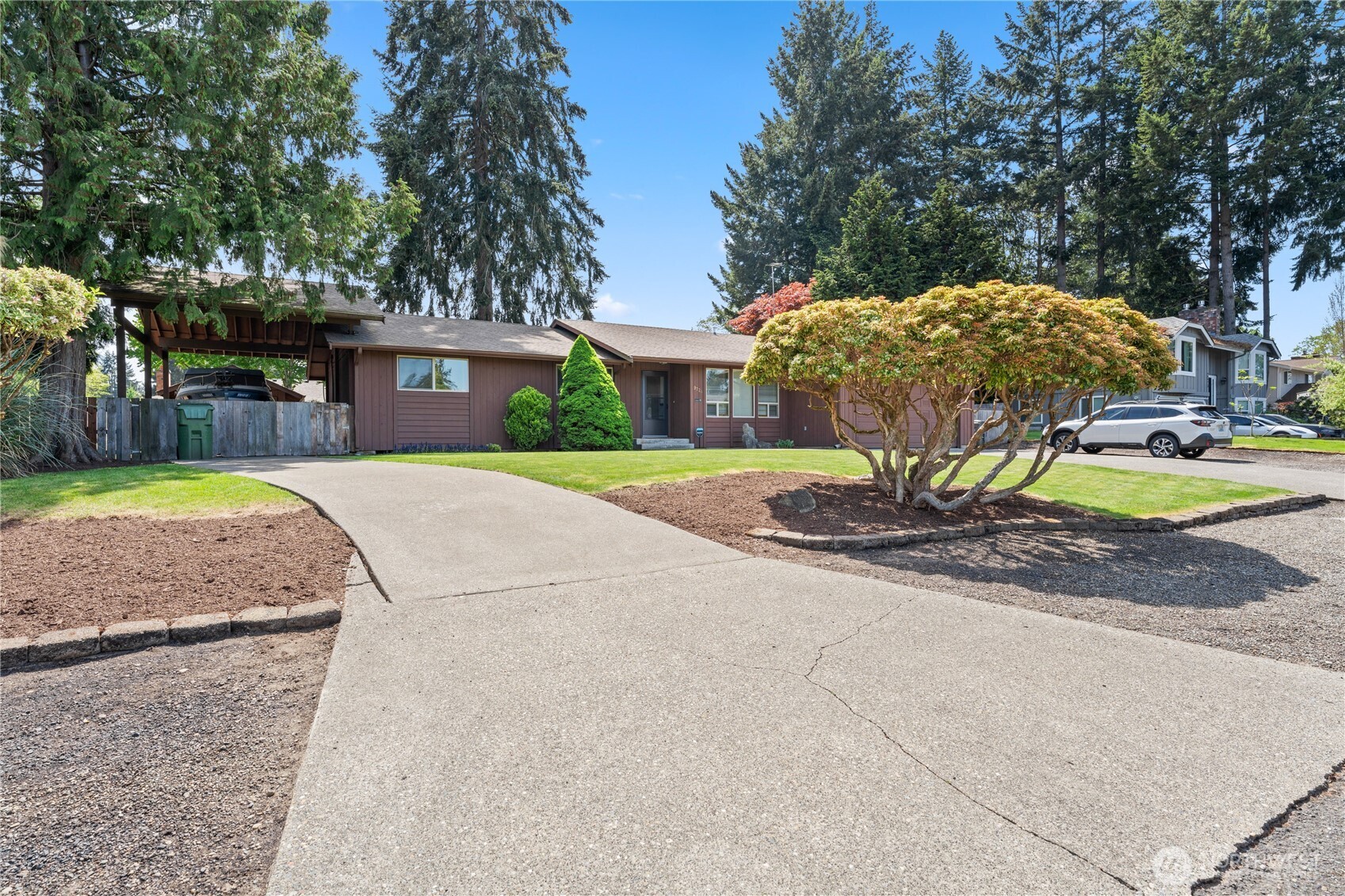 Secondary driveway that leads to the covered RV area.
