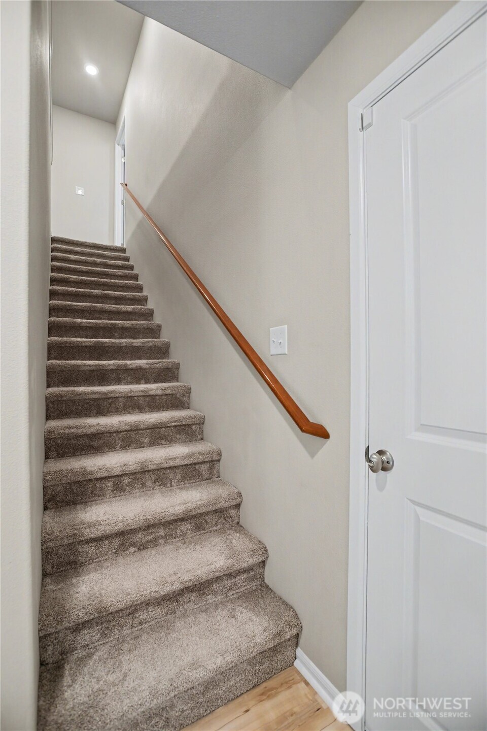 garage access door to the right, upstairs to all bedrooms