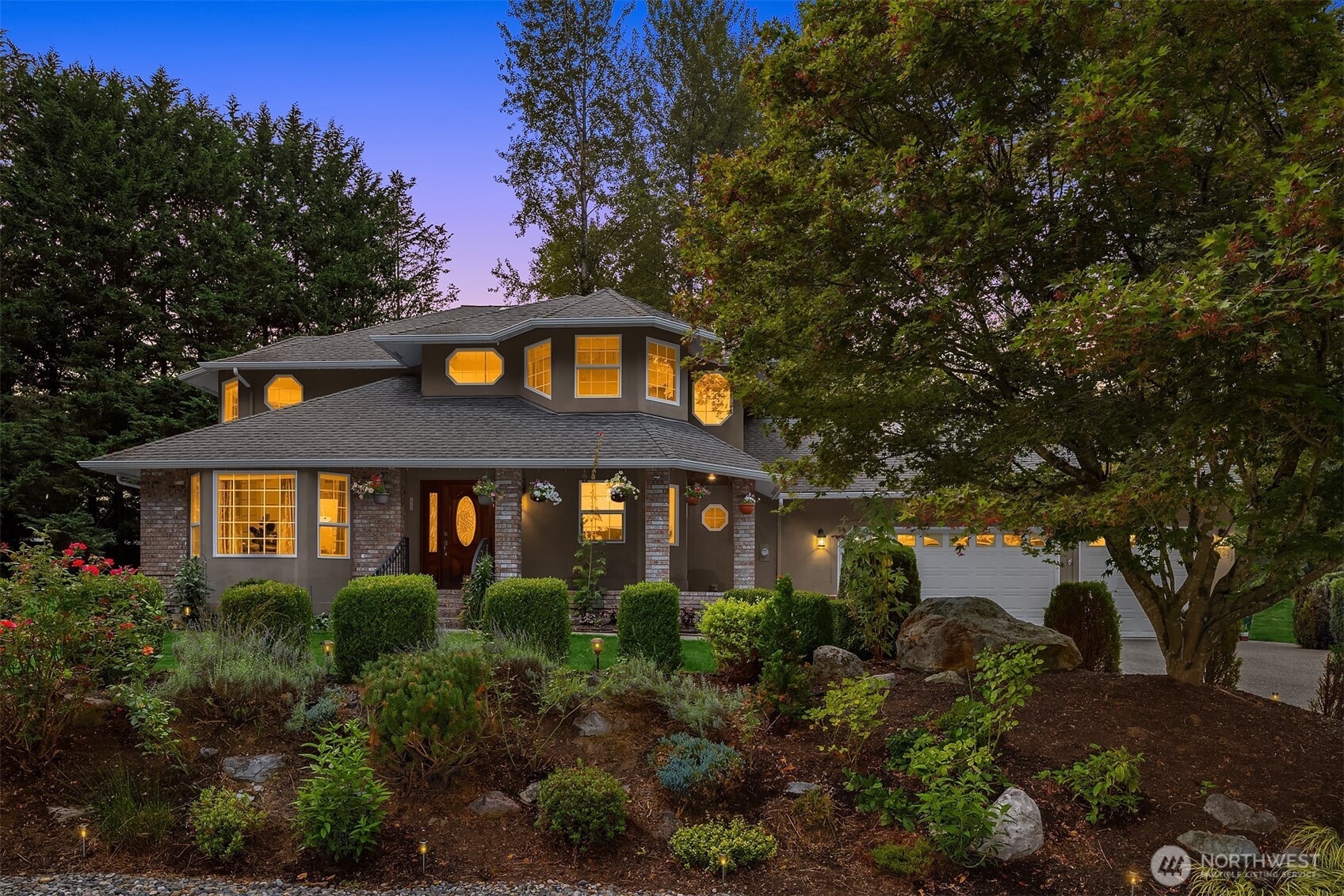 Manicured gardens and lush greenery enhance the estate-like feel of the property.