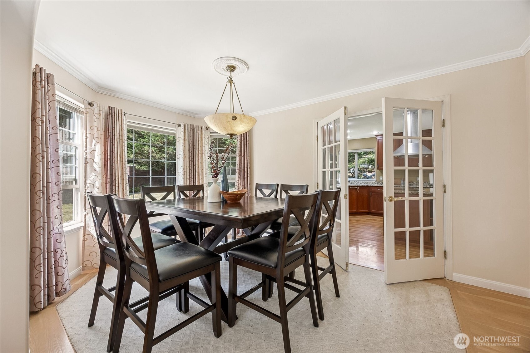 French doors close off the kitchen for a more private dinner venue.