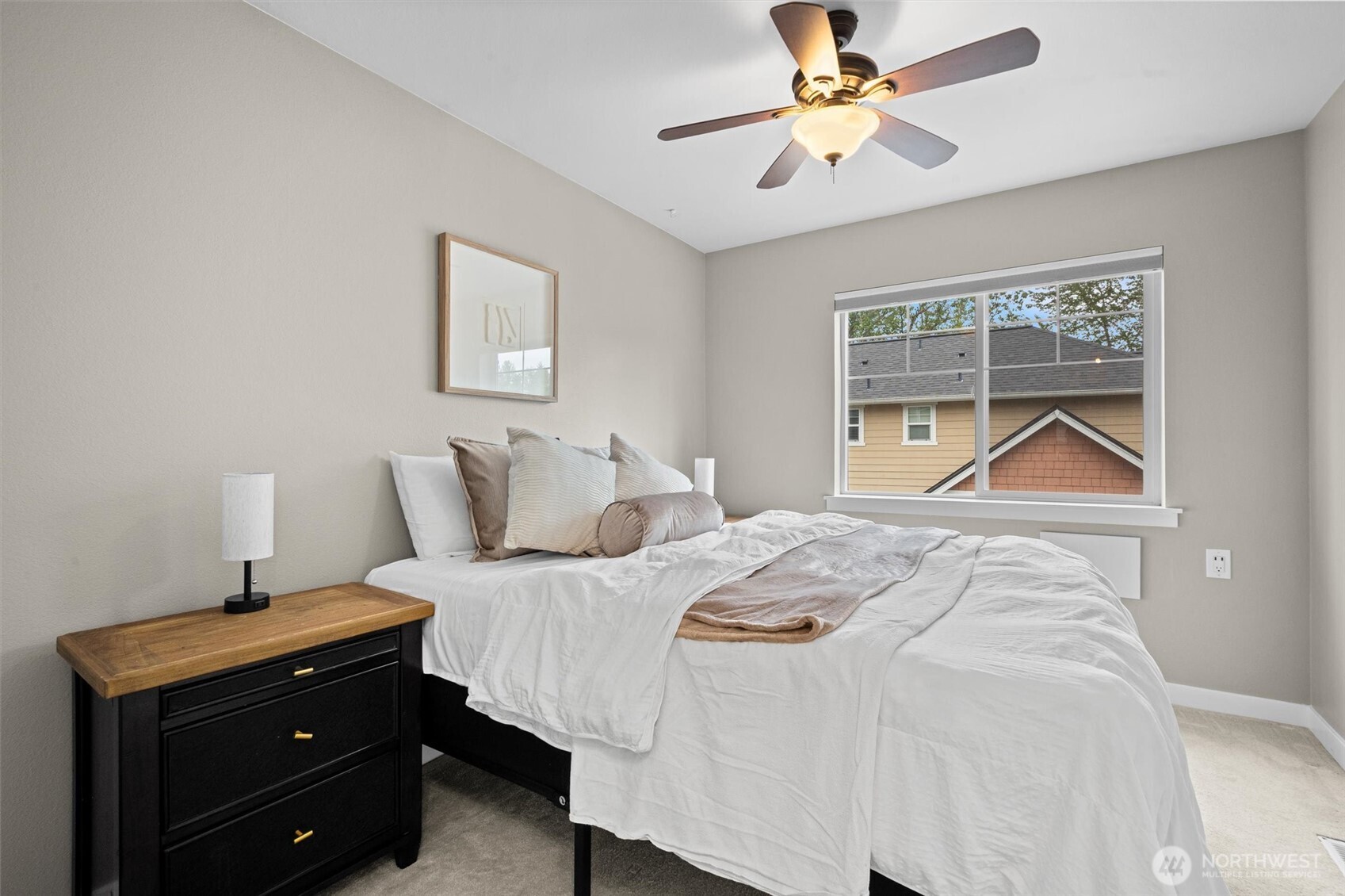 The 2nd bedroom is spacious and offers a ceiling fan.