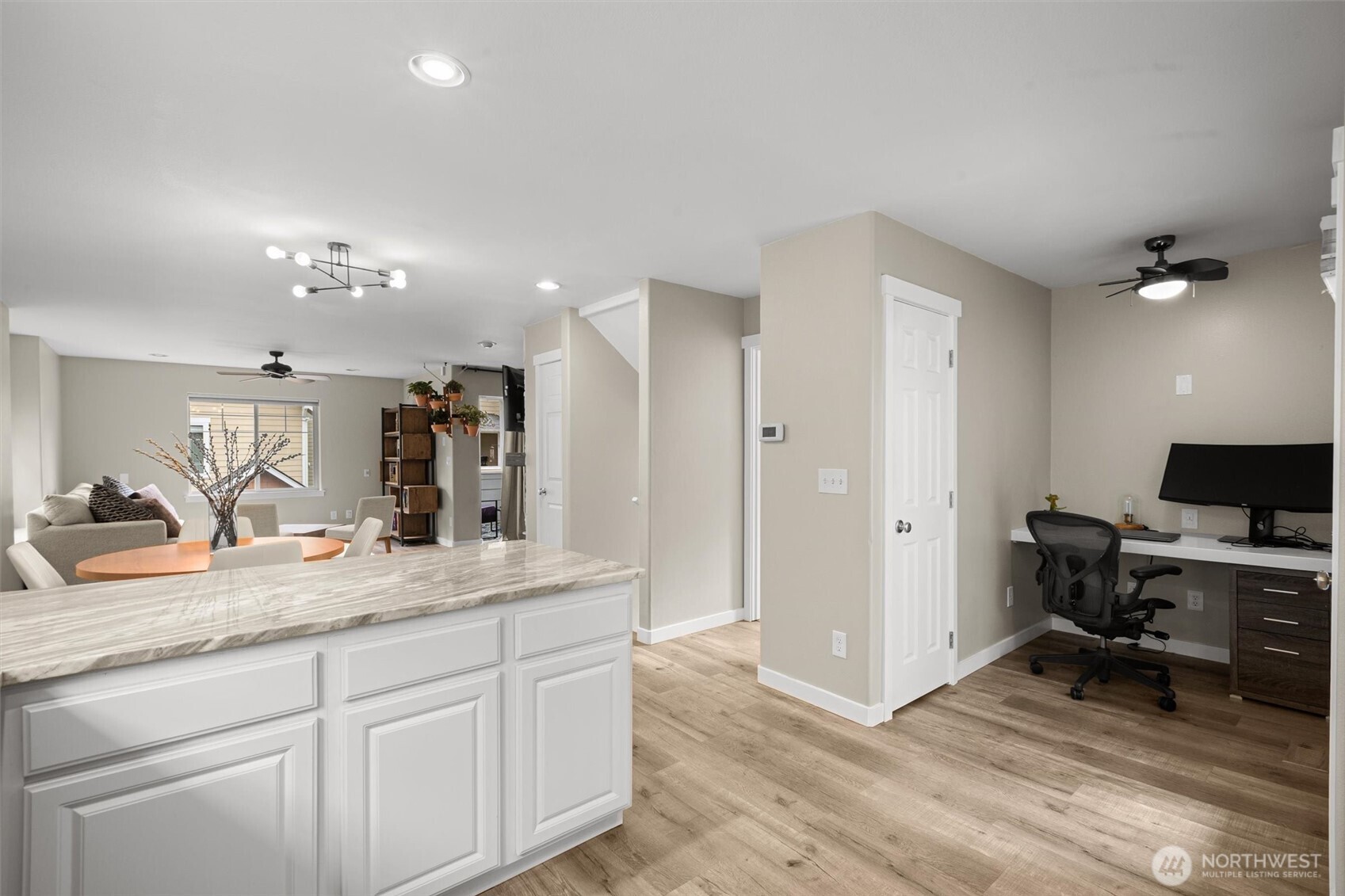 Off the kitchen is a nook for work-from-home or keeping organized. Don't miss the storage closet.