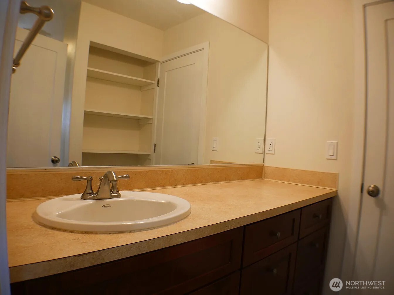Vanity linen closet and 2nd door access to Primary BR from this 2nd shot of bathroom