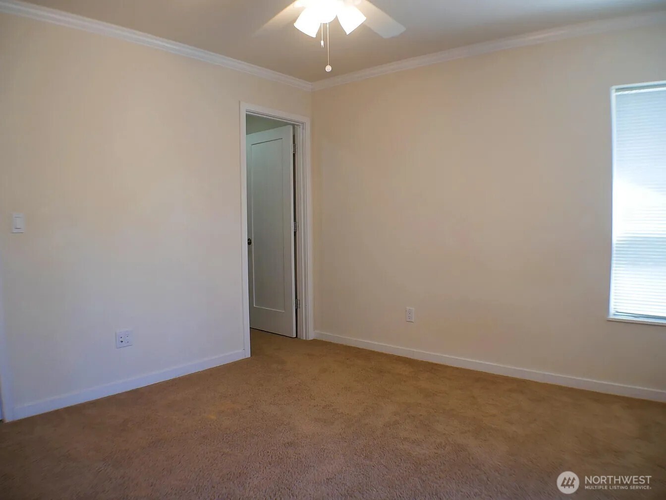 Primary BR with continental bath and 2 windows.    the walk-in closet access is shown here.  NOTE:  This unit features 2 ceiling fan lights.