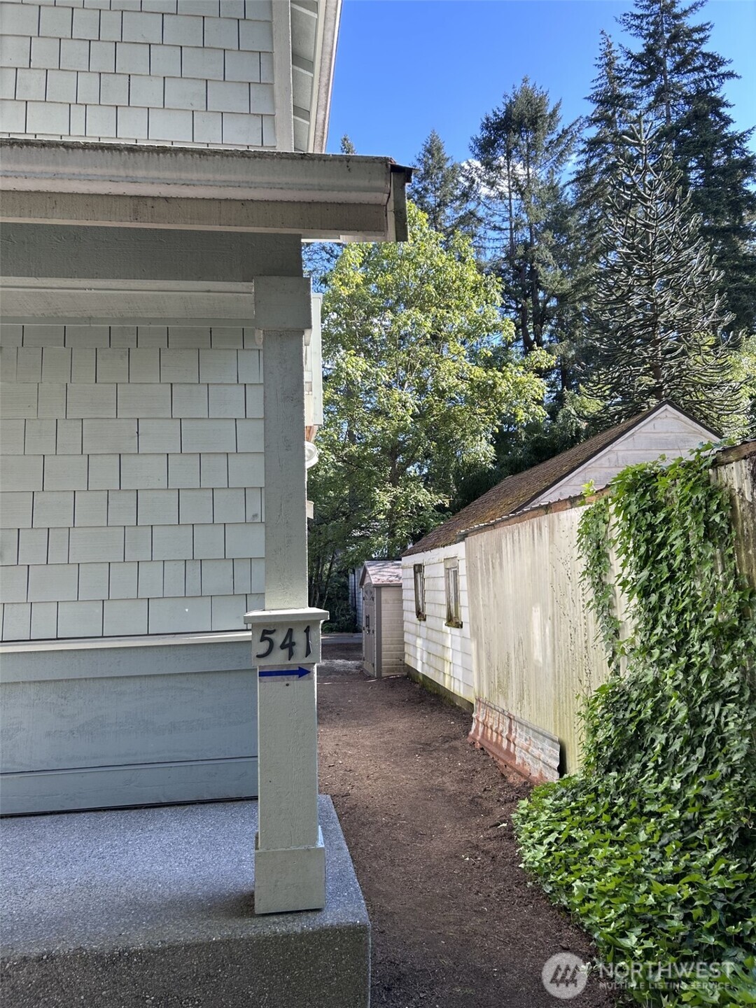 UNIT #541:  Quick walk around right side of porch to back for access f the 2 bedroom unit.