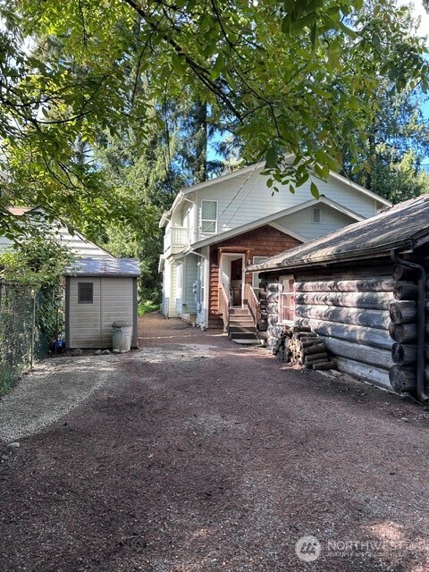 NOTE: There is also access to approach UNIT #541 off back alley past the back side of the Log Cabin.  (notice there is a nice 6X6 shed for lawn tools and such)
