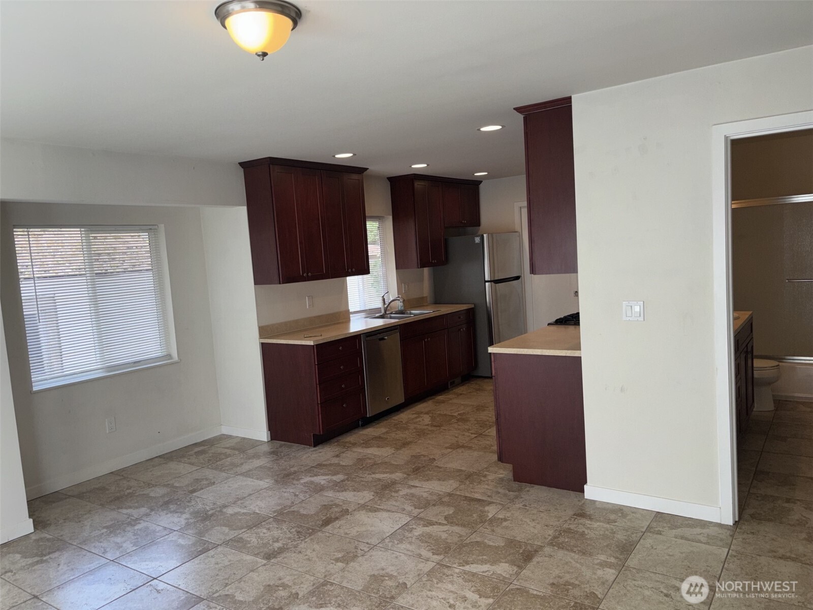 Plenty of area for your kitchen eating nook with lots of sun on those spring and summer days we are now enjoying.  Continental Full bath door is shown at right.