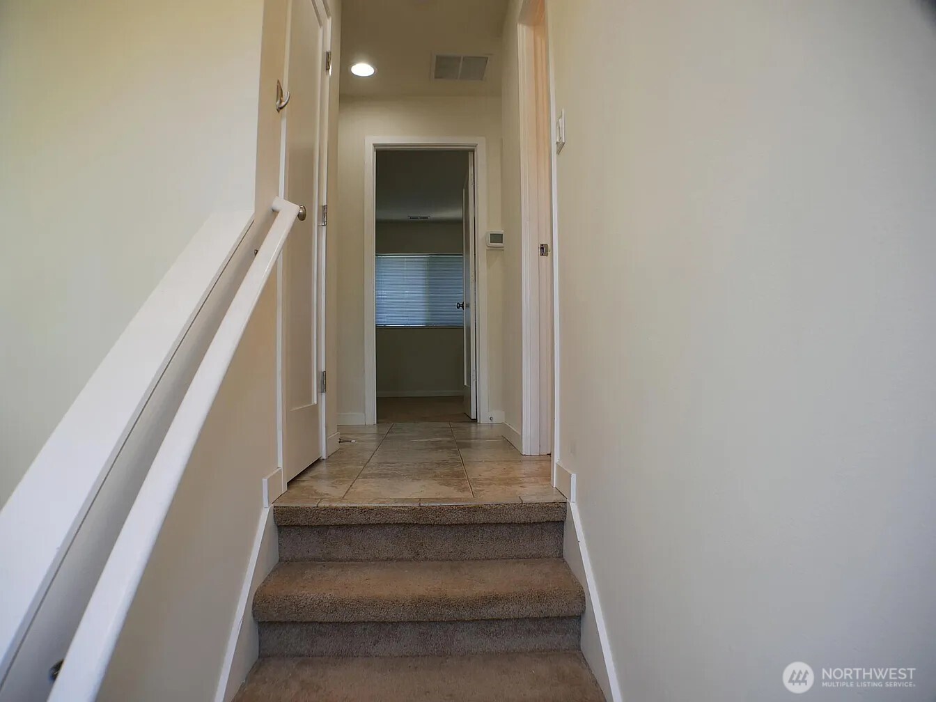 UNIT # 543:  At top of it's stair access is a great room to left, a den/bedroom which is what you see shown here, and 2 more bedrooms to the right down the the hall Note:  you can see access to coat closet on left and access to bath on right