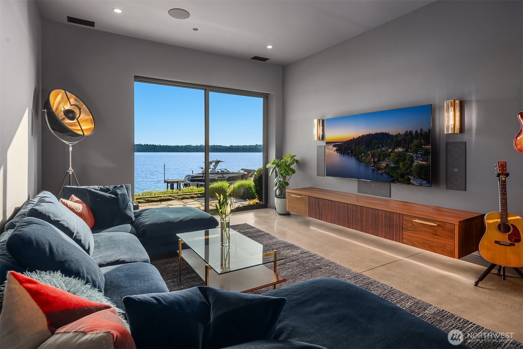 Home office with sliding glass door to the waterfront patio