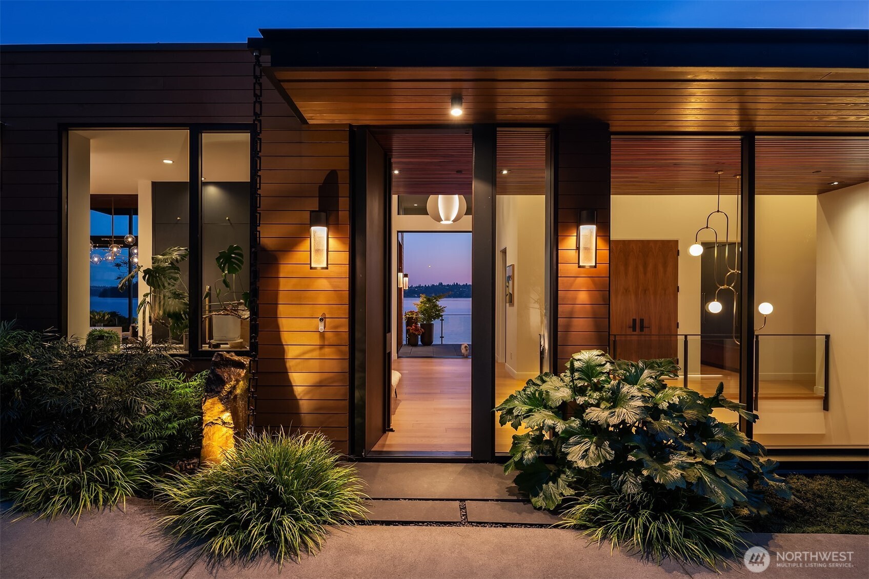 Living room with floor-to-ceiling windows overlooking the lake at su