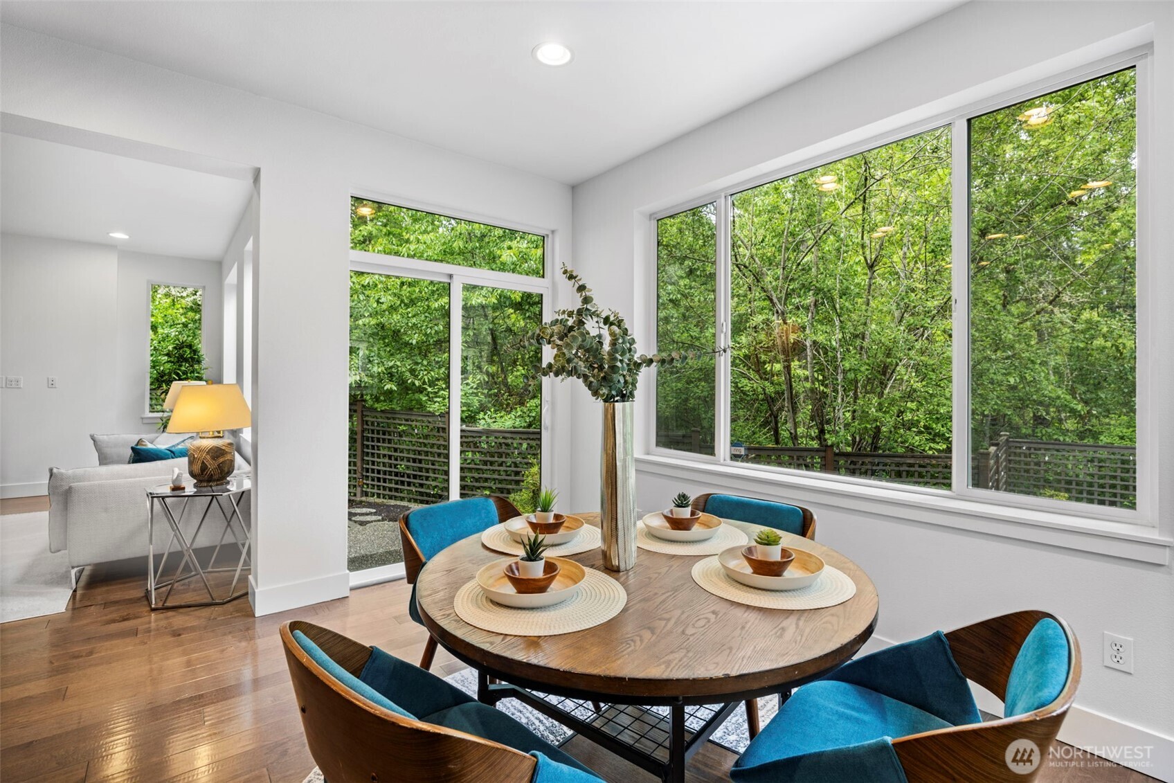 Kitchen nook leads to outside with load of privacy in backyard