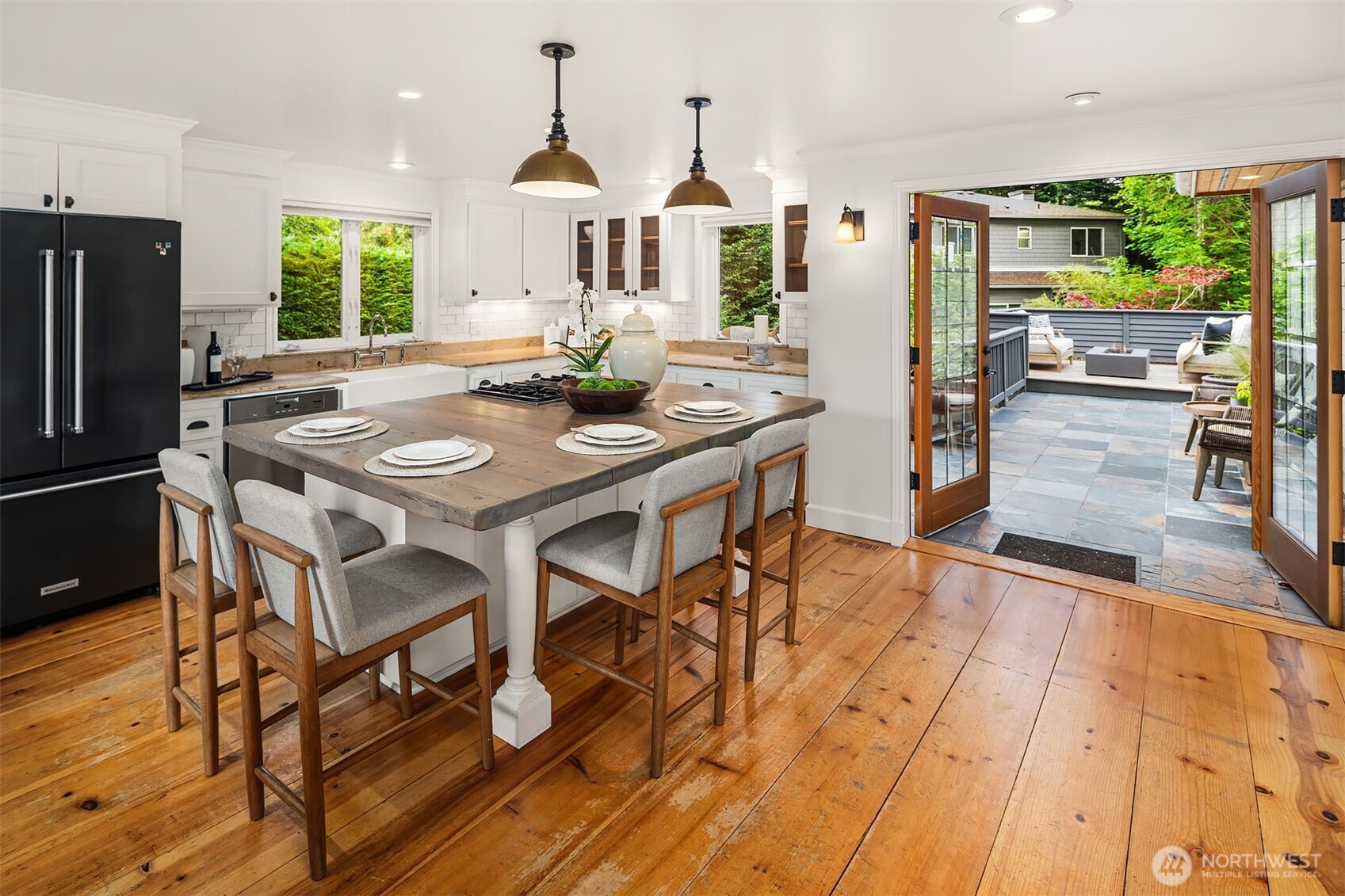 Kitchen flows seamlessly to the private deck for effortless entertaining